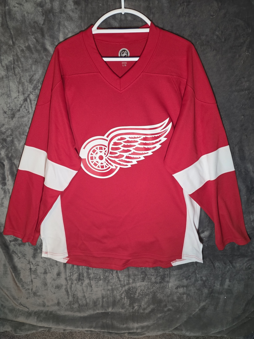 Official NHL branded Nicklas Lidstrom #5 Detroit Red Wings hockey jersey